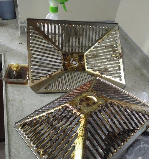 如何清洗打孔油烟机（教你打孔油烟机清洗技巧，解决厨房污染问题）  第1张